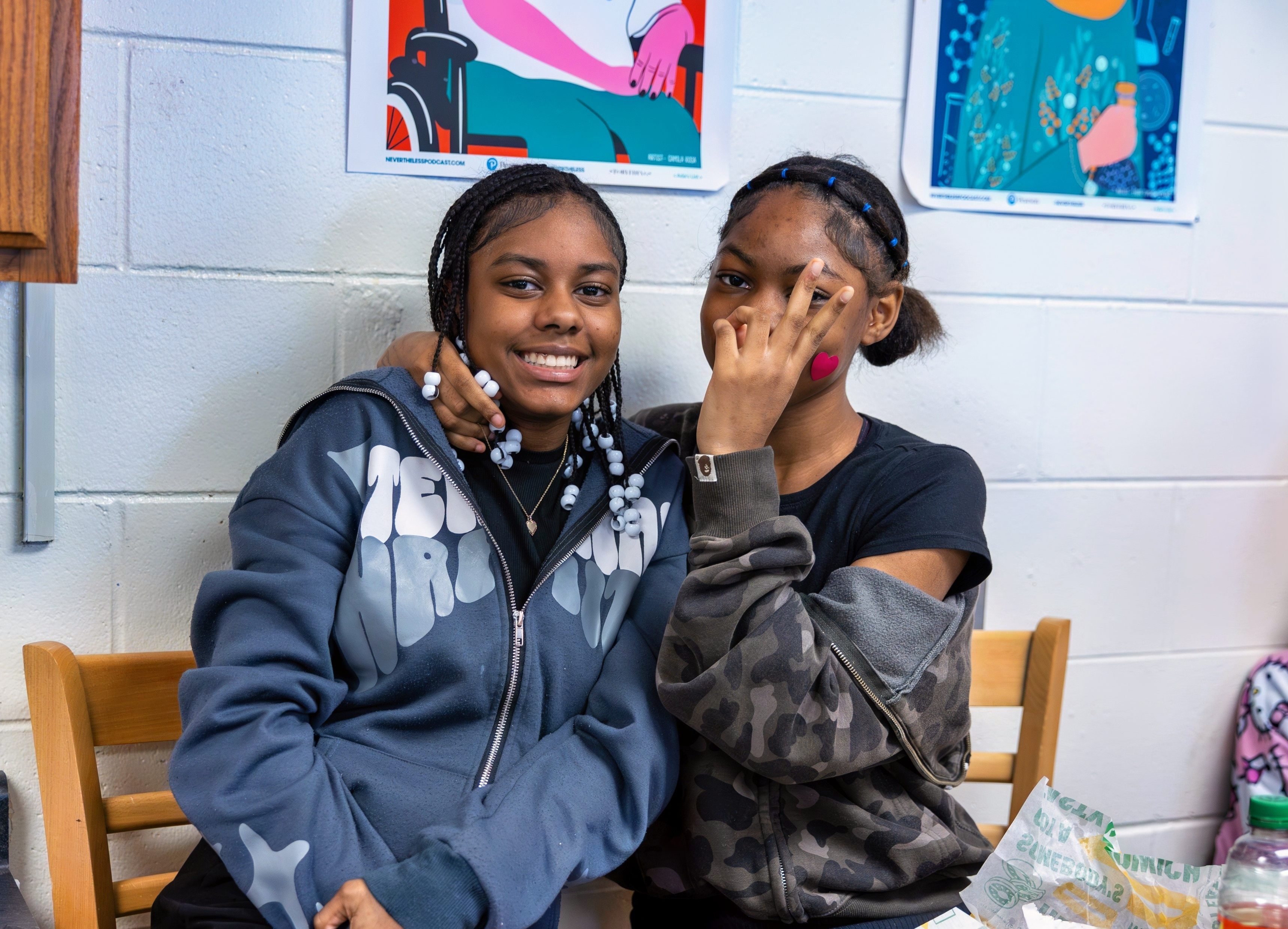 JPEC students sitting in a classroom posing for the camera.