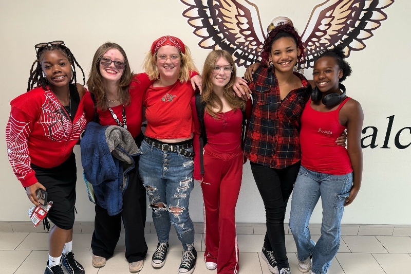 6 female Jackson Preparatory & Early College students smile and pose together.