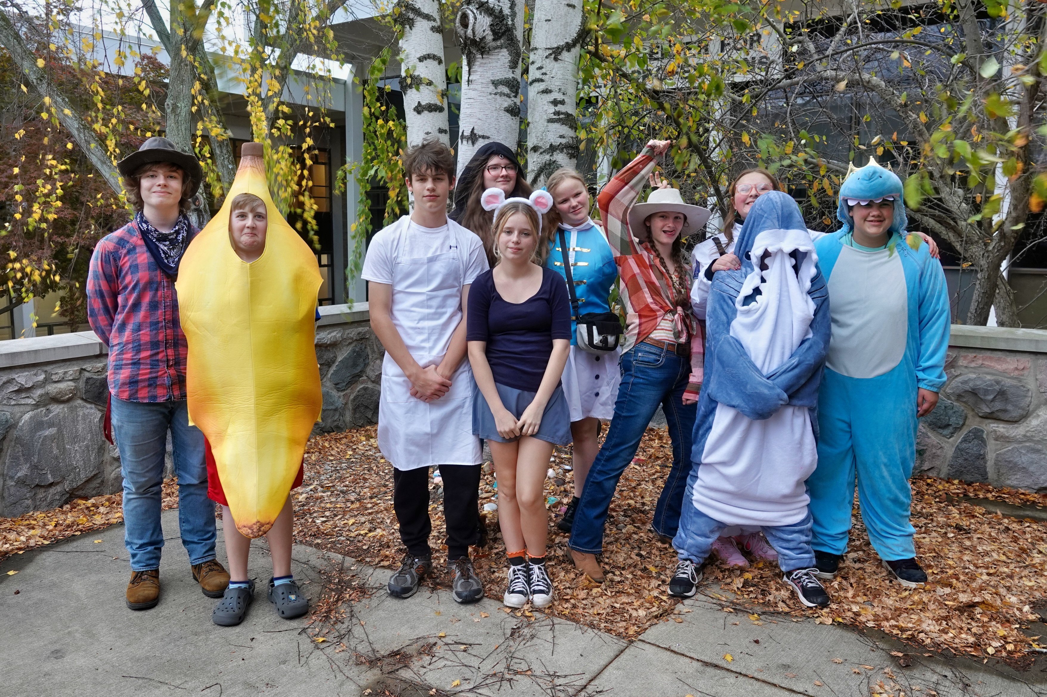 Several Jackson Preparatory & Early College students dressed in Halloween costumes standing outside
