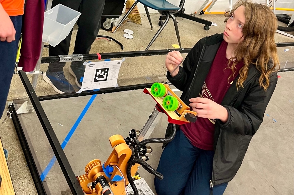 Jackson Preparatory & Early College students work on a robot during robotics class.