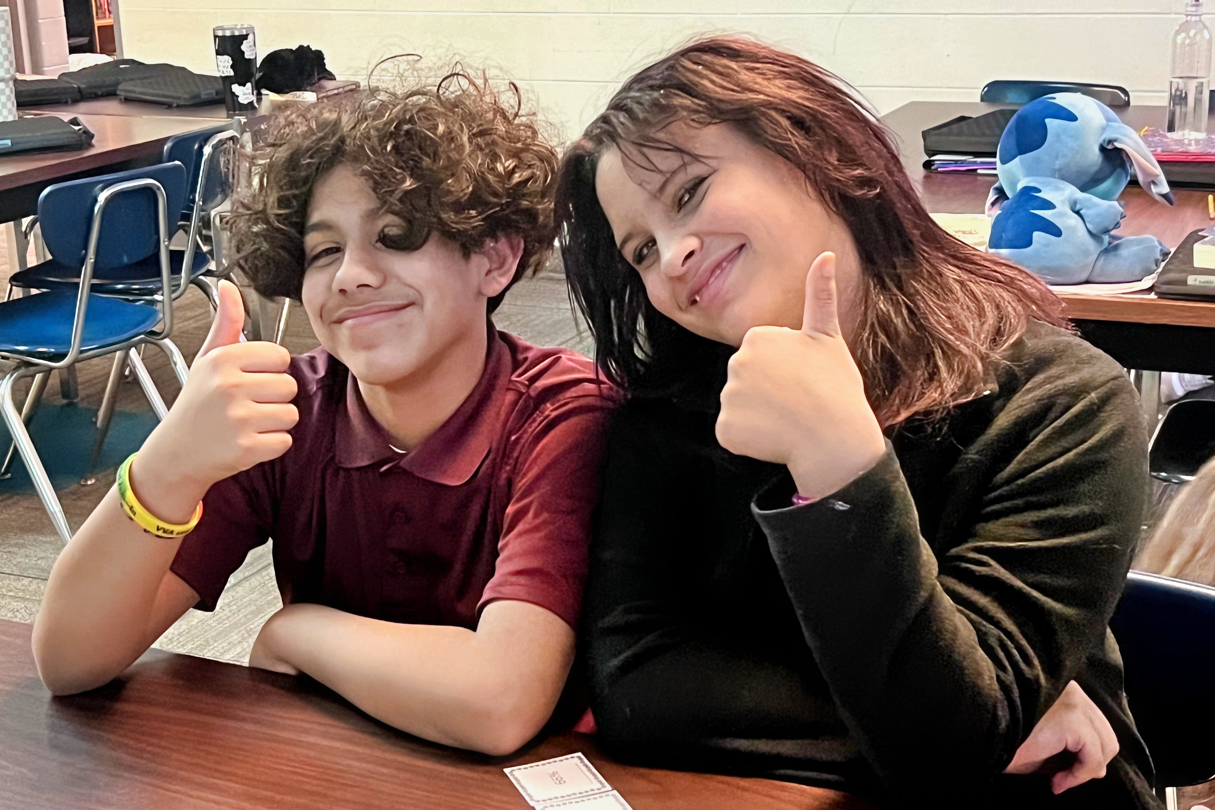 Jackson Preparatory & Early College students holding their thumbs up and smiling.